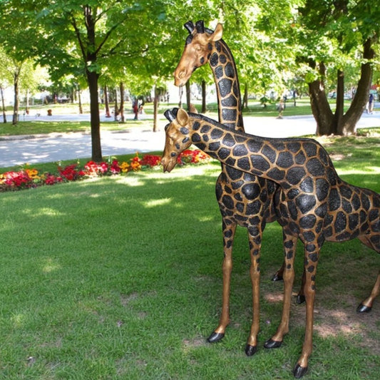 Pair of Giraffes Bronze Statues - Size: 32"L x 12"W x 55"H.