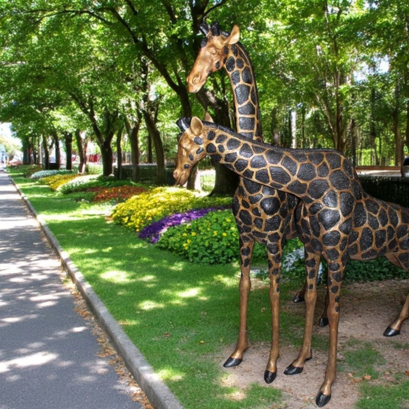 Pair of Giraffes Bronze Statues -  Size: 32"L x 12"W x 55"H.