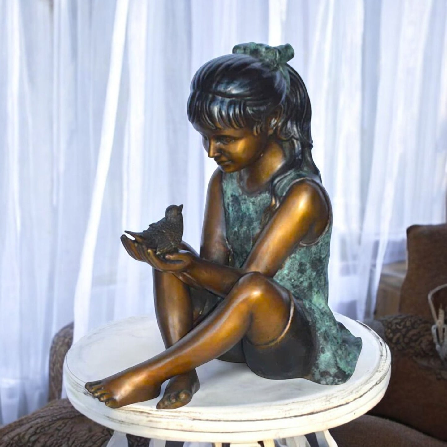 Girl Knees Up Holding a Bird Bronze Statue - Size: 22"L x 14"W x 24"H.