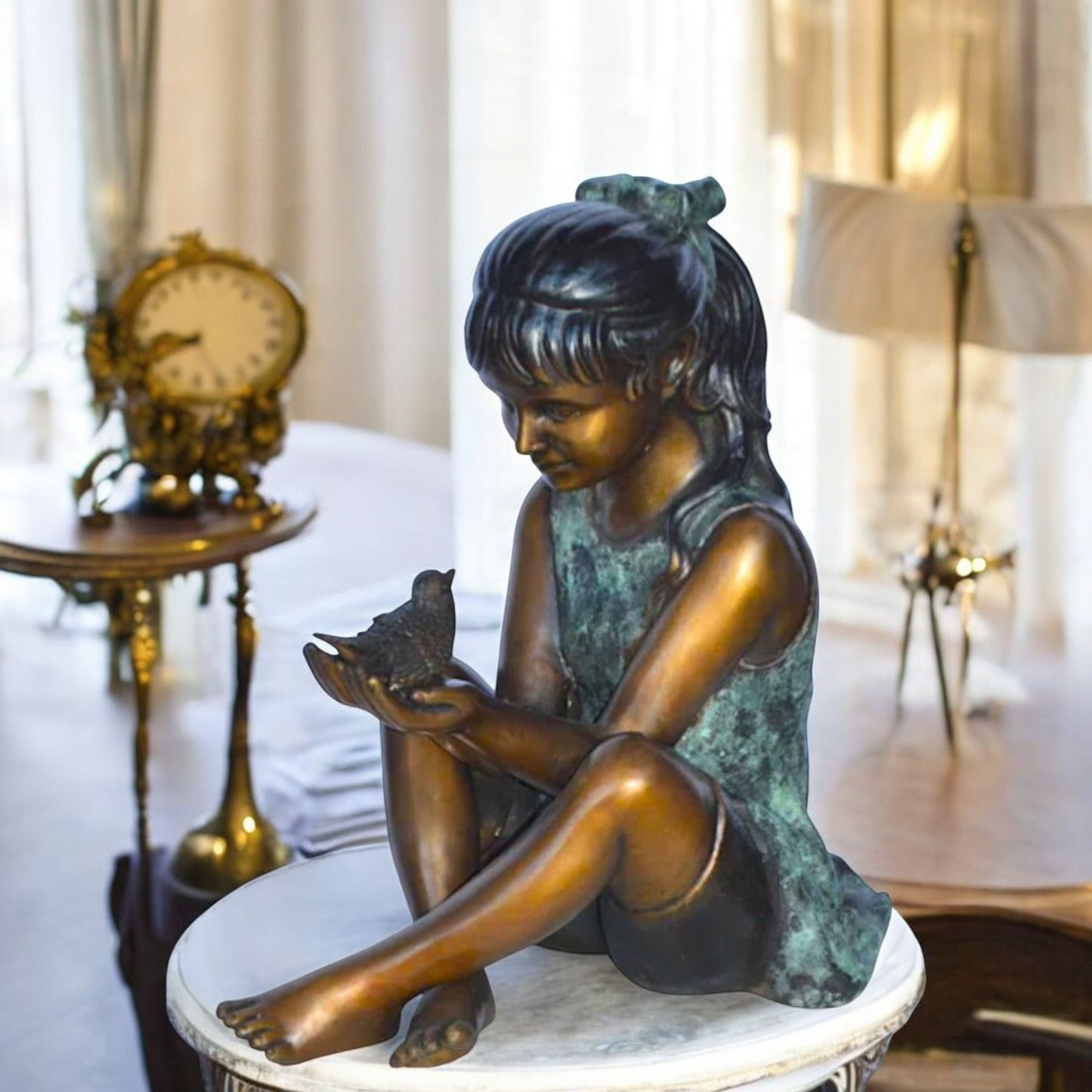 Girl Knees Up Holding a Bird Bronze Statue - Size: 22"L x 14"W x 24"H.