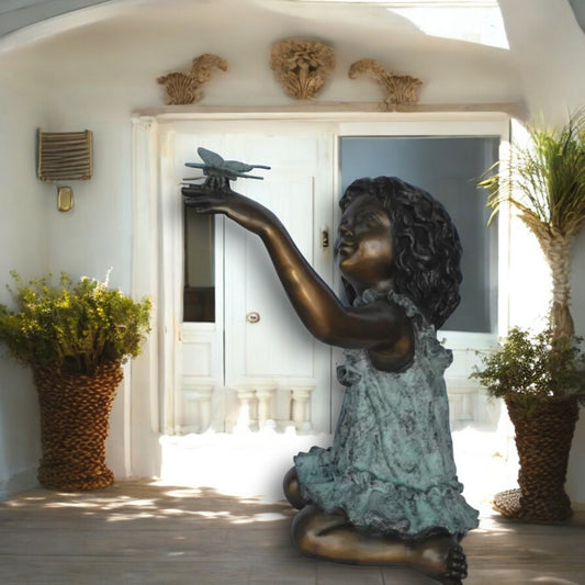 Girl Playing With Butterfly Bronze Statue -  Size: 21"L x 15"W x 19"H.