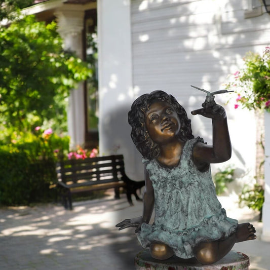 Girl Playing With Butterfly Bronze Statue -  Size: 21"L x 15"W x 19"H.