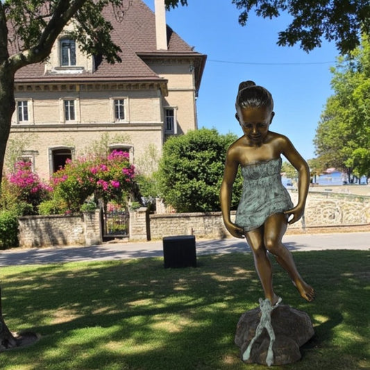 Girl looking at a frog bronze statue -  Size: 16"L x 13"W x 36"H.