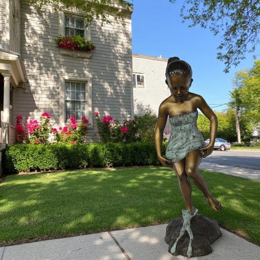 Girl looking at a frog bronze statue -  Size: 16"L x 13"W x 36"H.