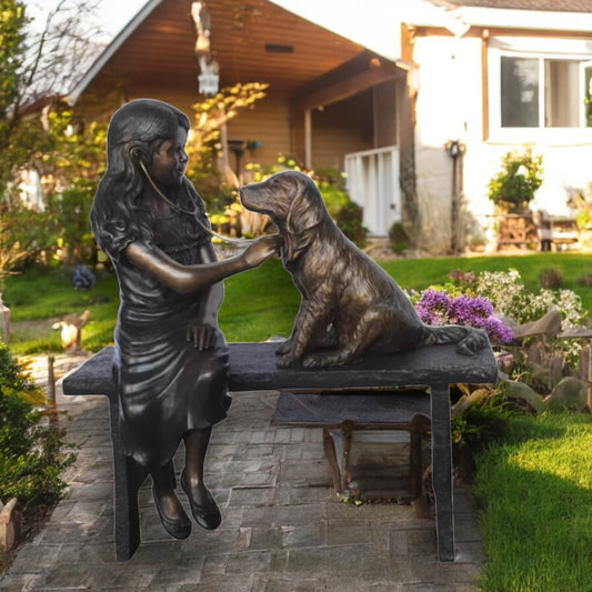 Girl plays Doctor on a Bench W Dog Bronze Statue - Size: 38"L x 18"W x 39"H.