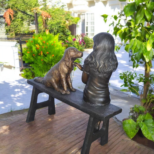 Girl plays Doctor on a Bench W Dog Bronze Statue - Size: 38"L x 18"W x 39"H.