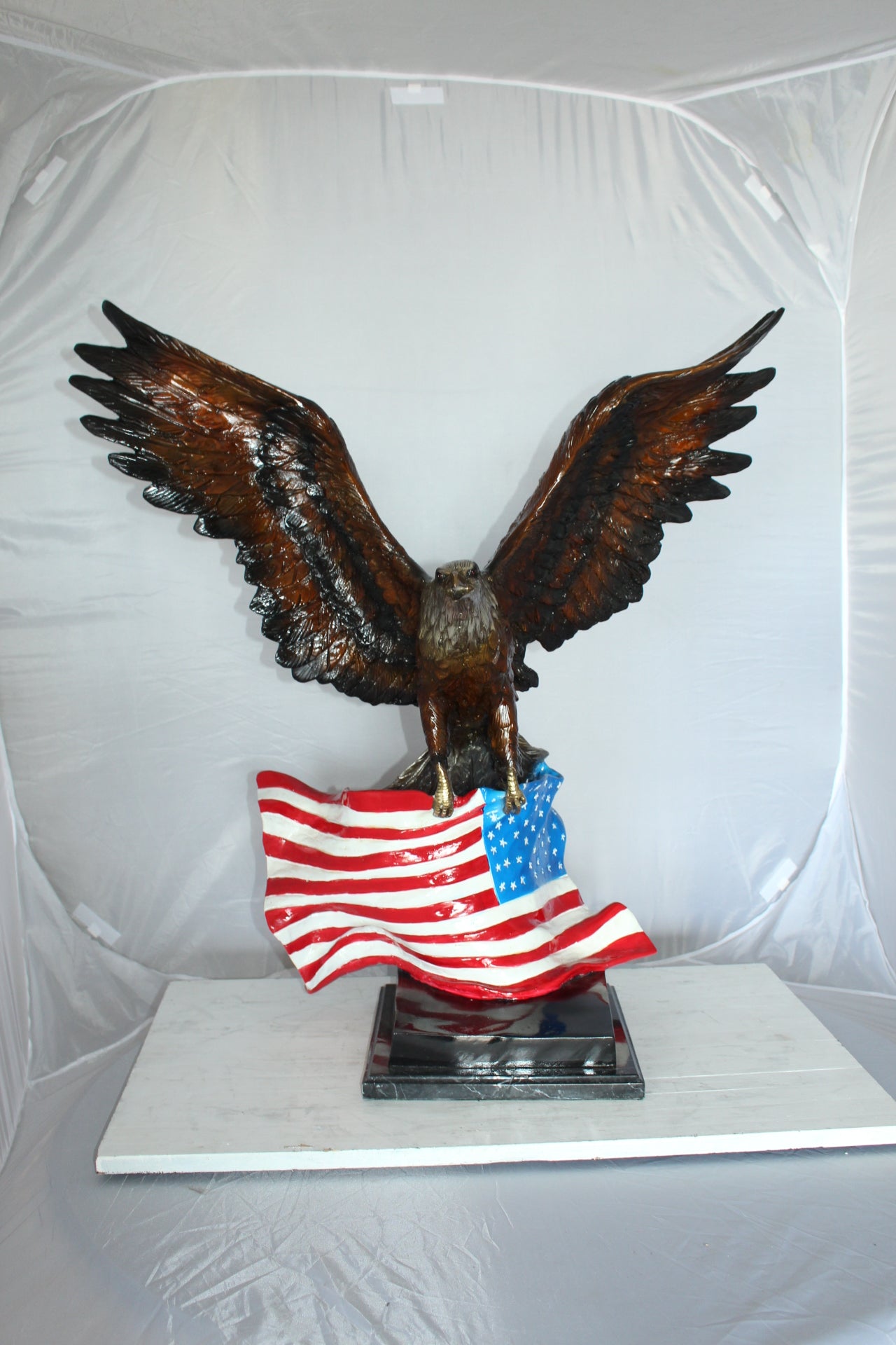 Eagle with American Flag Bronze Statue - Size: 32"L x 14"W x 35"H.