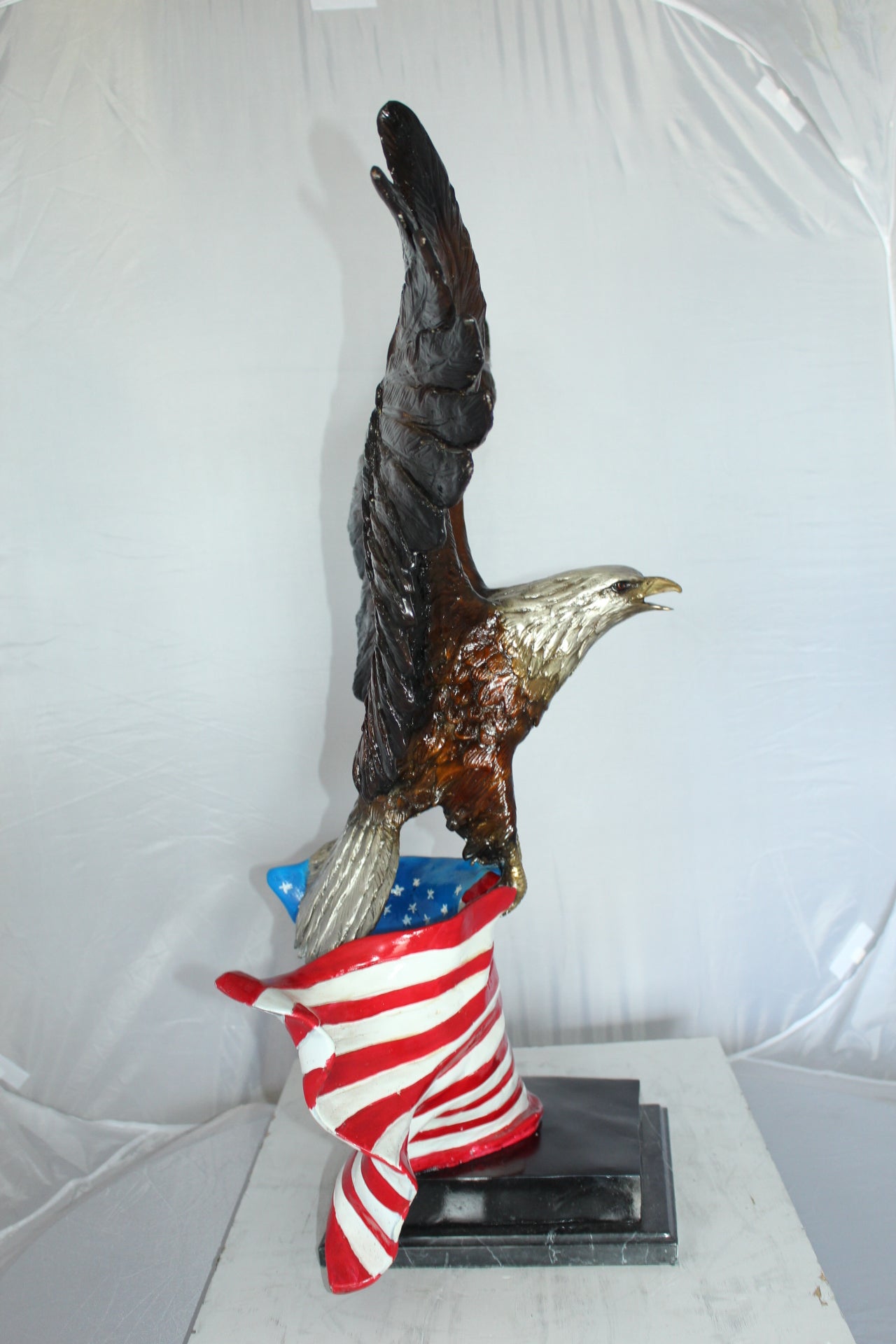 Eagle with American Flag Bronze Statue - Size: 32"L x 14"W x 35"H.