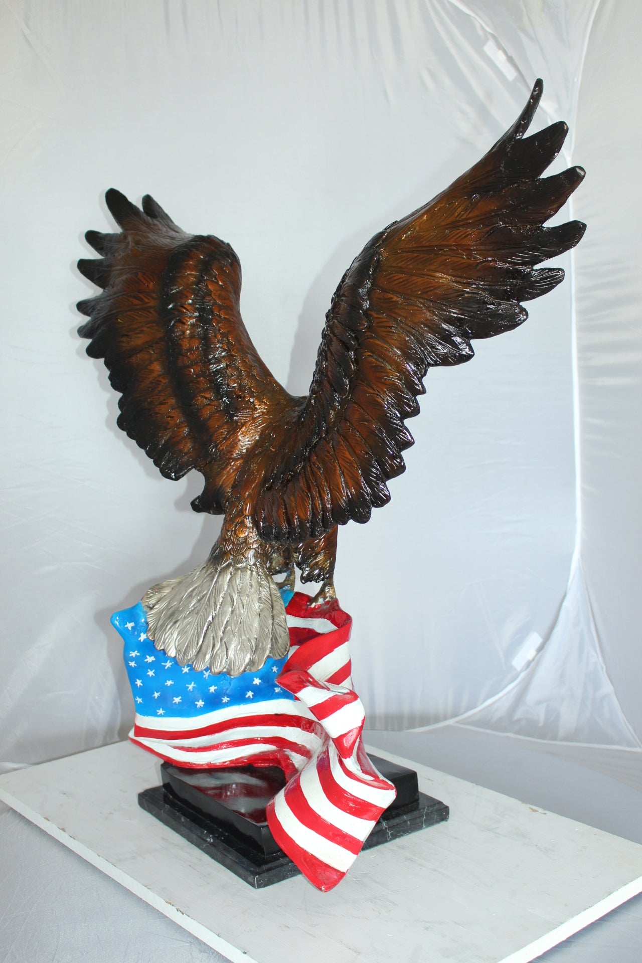 Eagle with American Flag Bronze Statue - Size: 32"L x 14"W x 35"H.