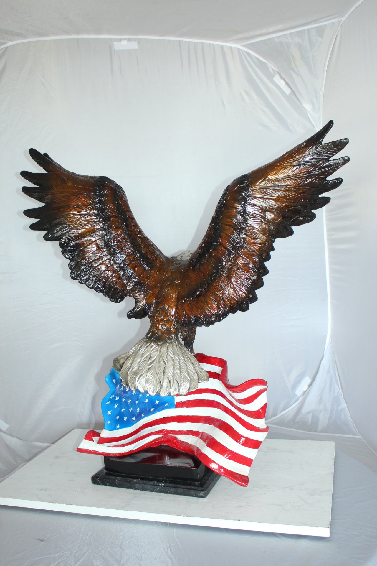 Eagle with American Flag Bronze Statue - Size: 32"L x 14"W x 35"H.