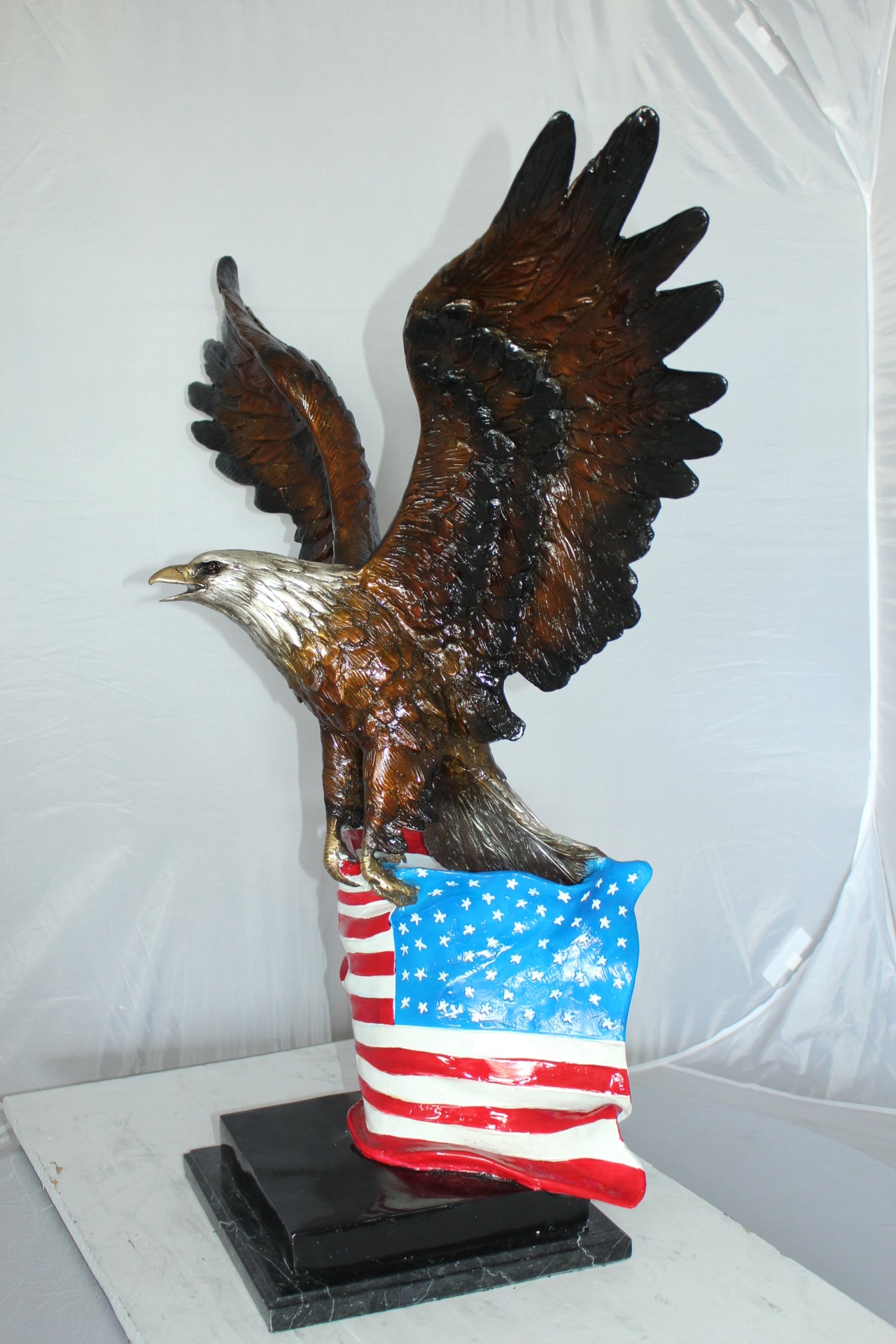 Eagle with American Flag Bronze Statue - Size: 32"L x 14"W x 35"H.