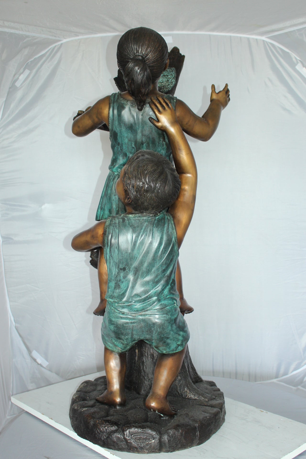 Two Kids Climbing on a Tree Bronze Statue - Size: 17"L x 17"W x 46"H.