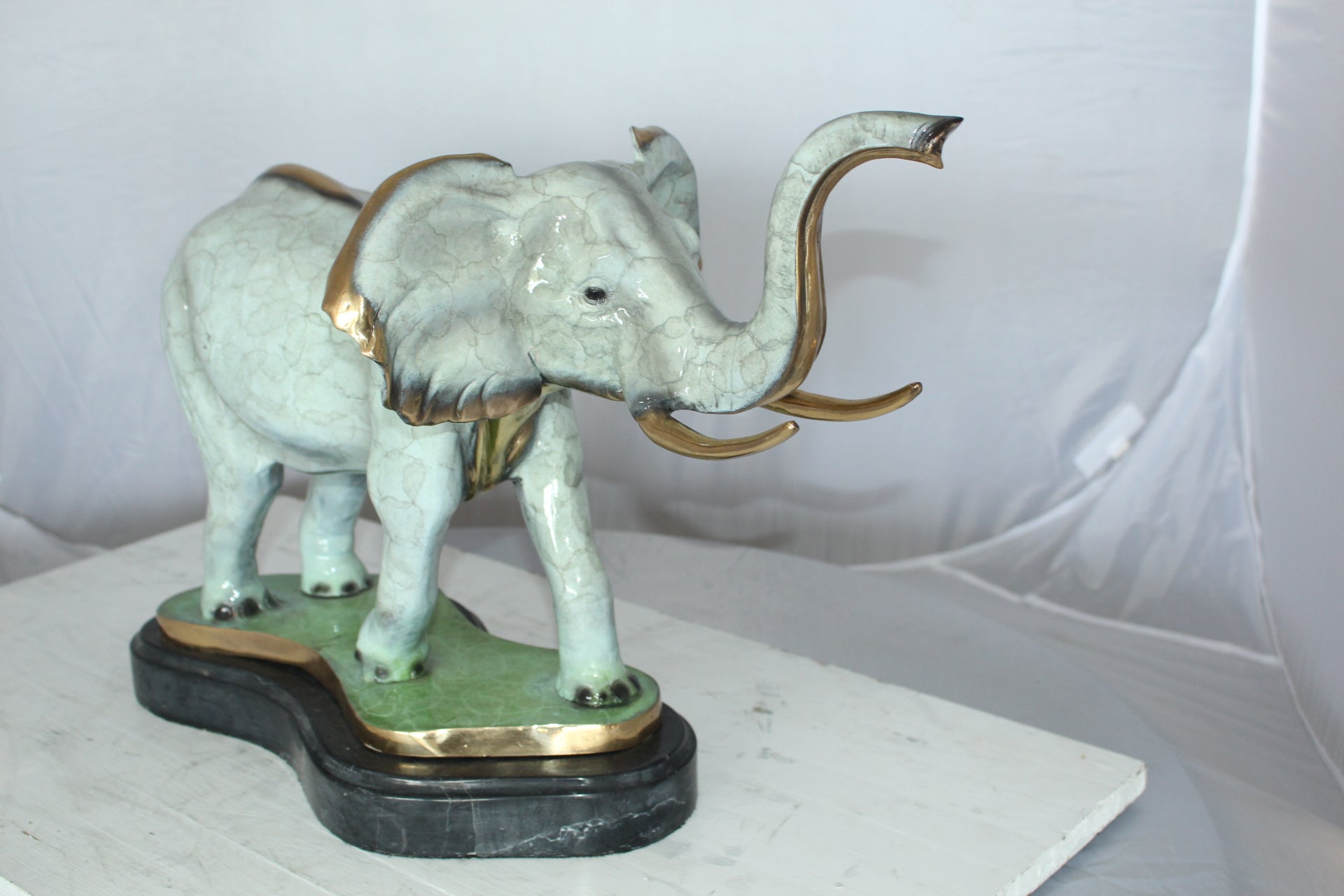 Elephant Medium Bronze Statue -  Size: 26"L x 8"W x 17"H.