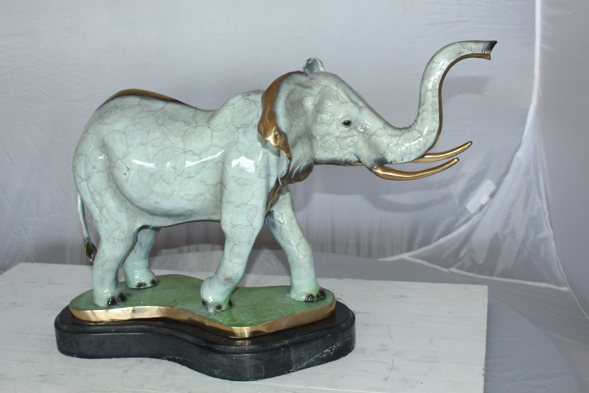 Elephant Medium Bronze Statue -  Size: 26"L x 8"W x 17"H.