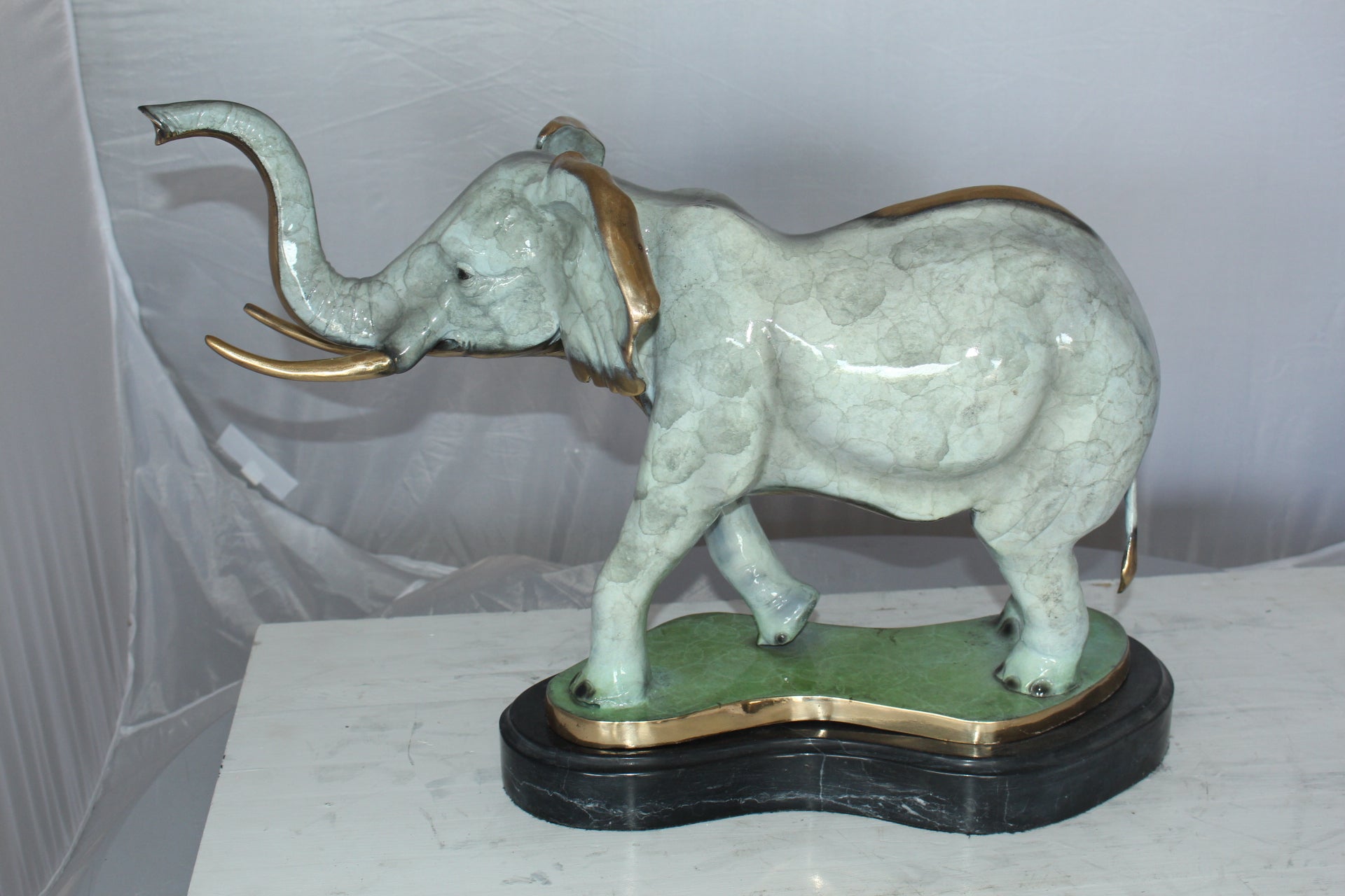 Elephant Medium Bronze Statue -  Size: 26"L x 8"W x 17"H.