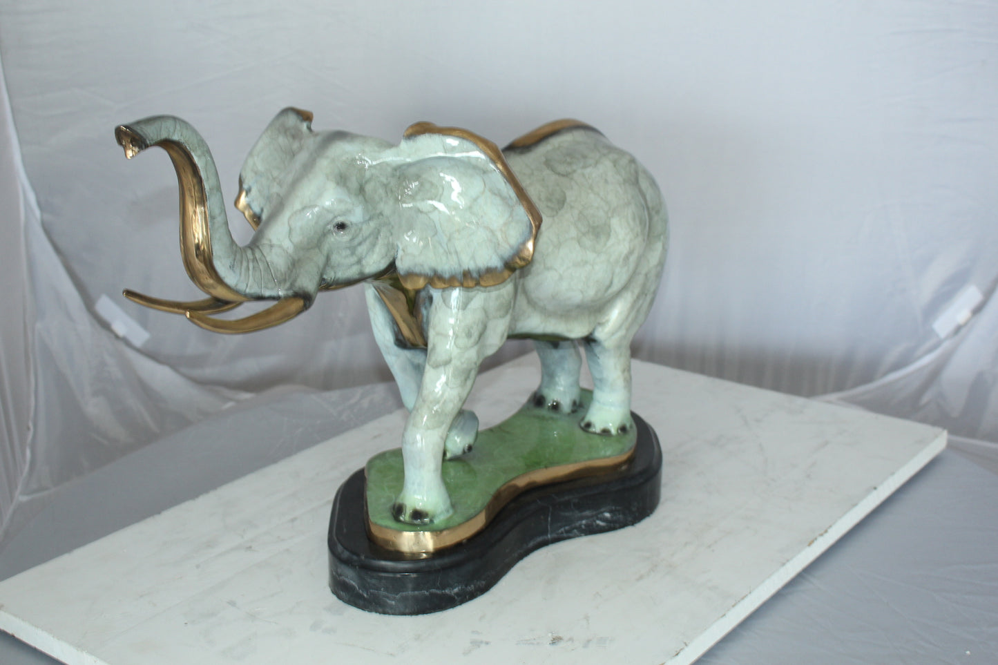 Elephant Medium Bronze Statue -  Size: 26"L x 8"W x 17"H.