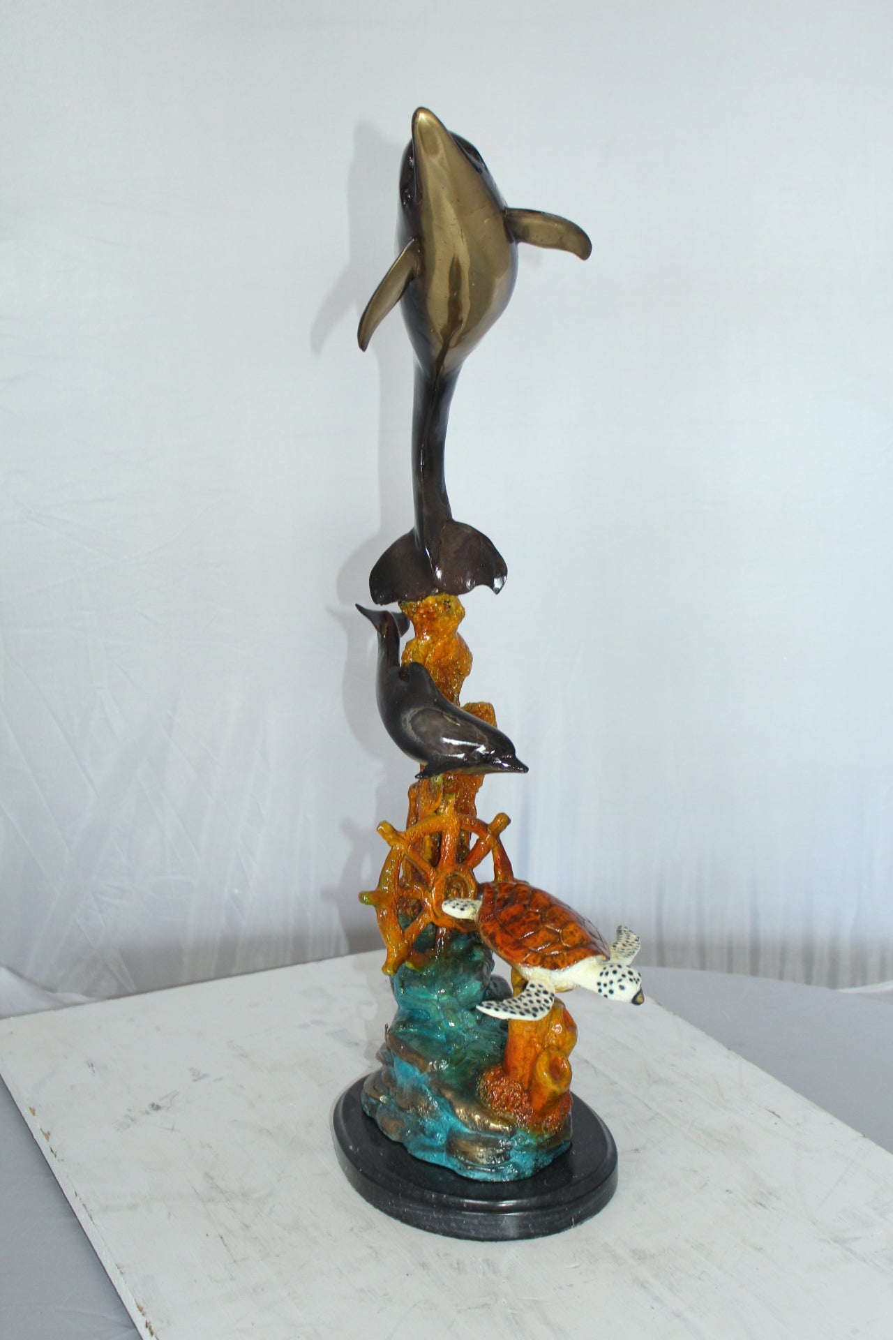Two Dolphins with Turtle bronze statue - Size: 14"L x 8"W x 28"H.