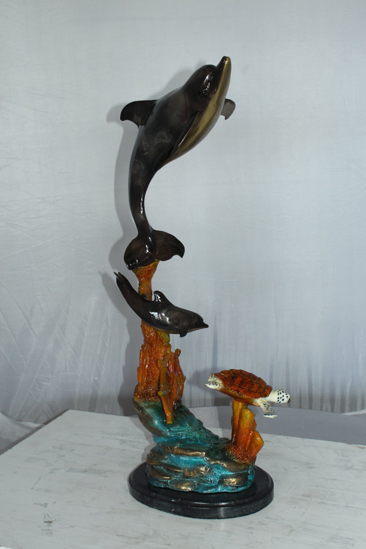 Two Dolphins with Turtle bronze statue - Size: 14"L x 8"W x 28"H.