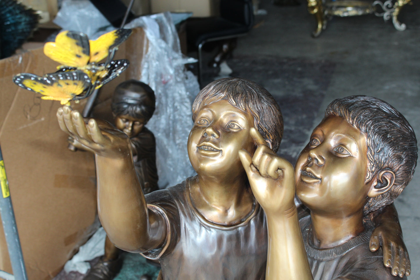 Two Kids Playing with Butterflies Bronze Statue - Size: 30"L x 30"W x 50"H.