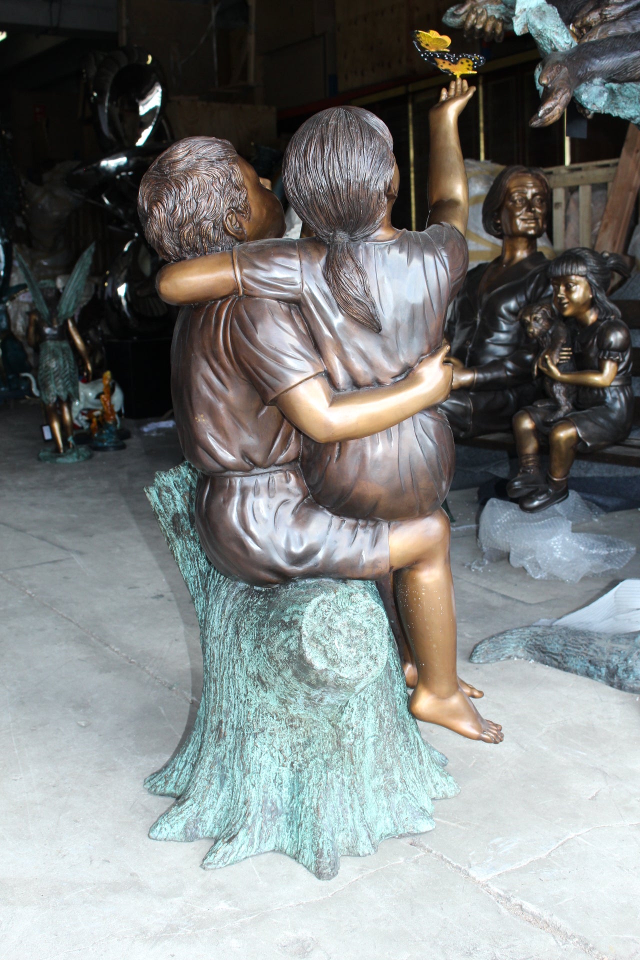 Two Kids Playing with Butterflies Bronze Statue - Size: 30"L x 30"W x 50"H.