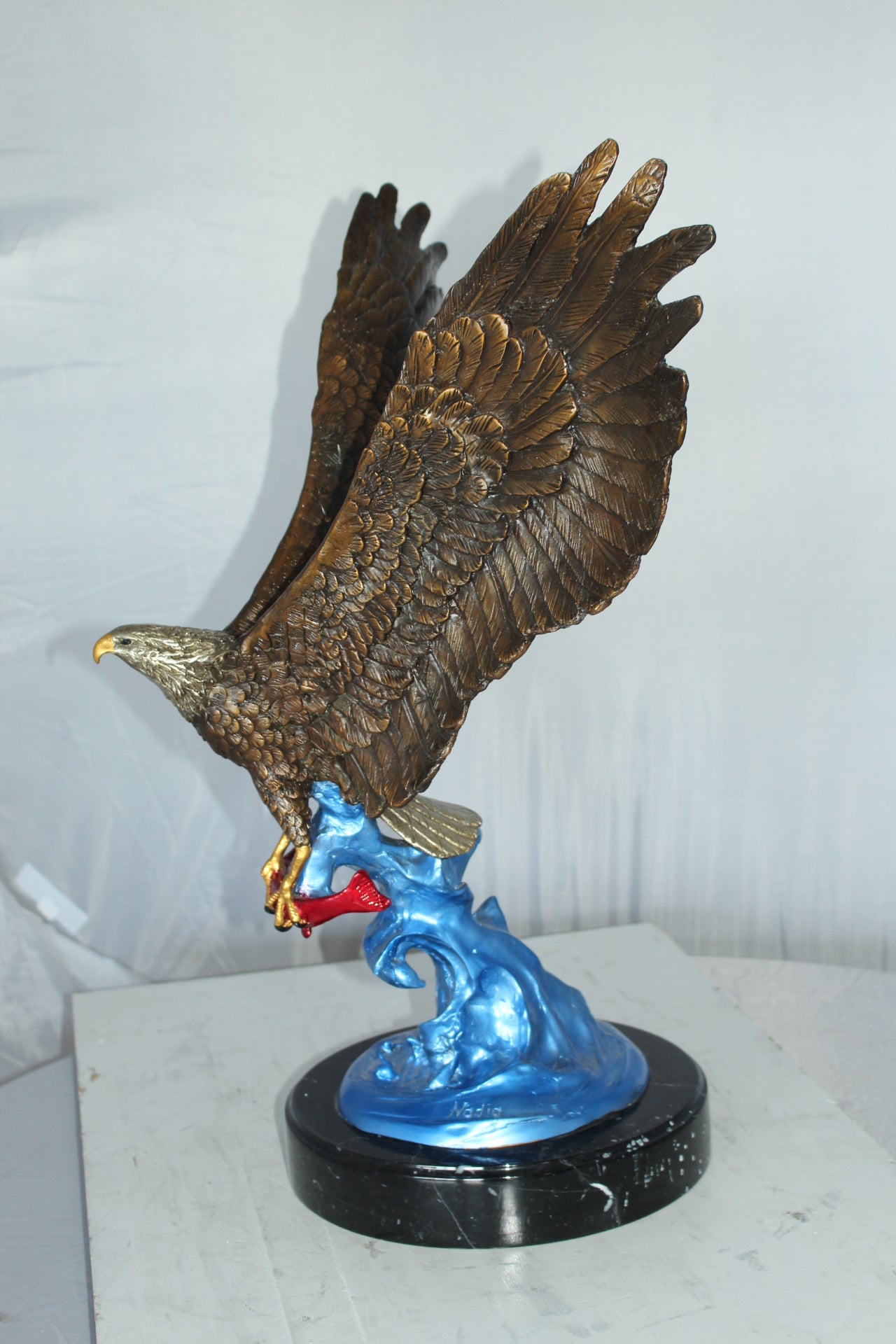Eagle Catching his Prey Bronze Statue - Size: 17"L x 20"W x 25"H.