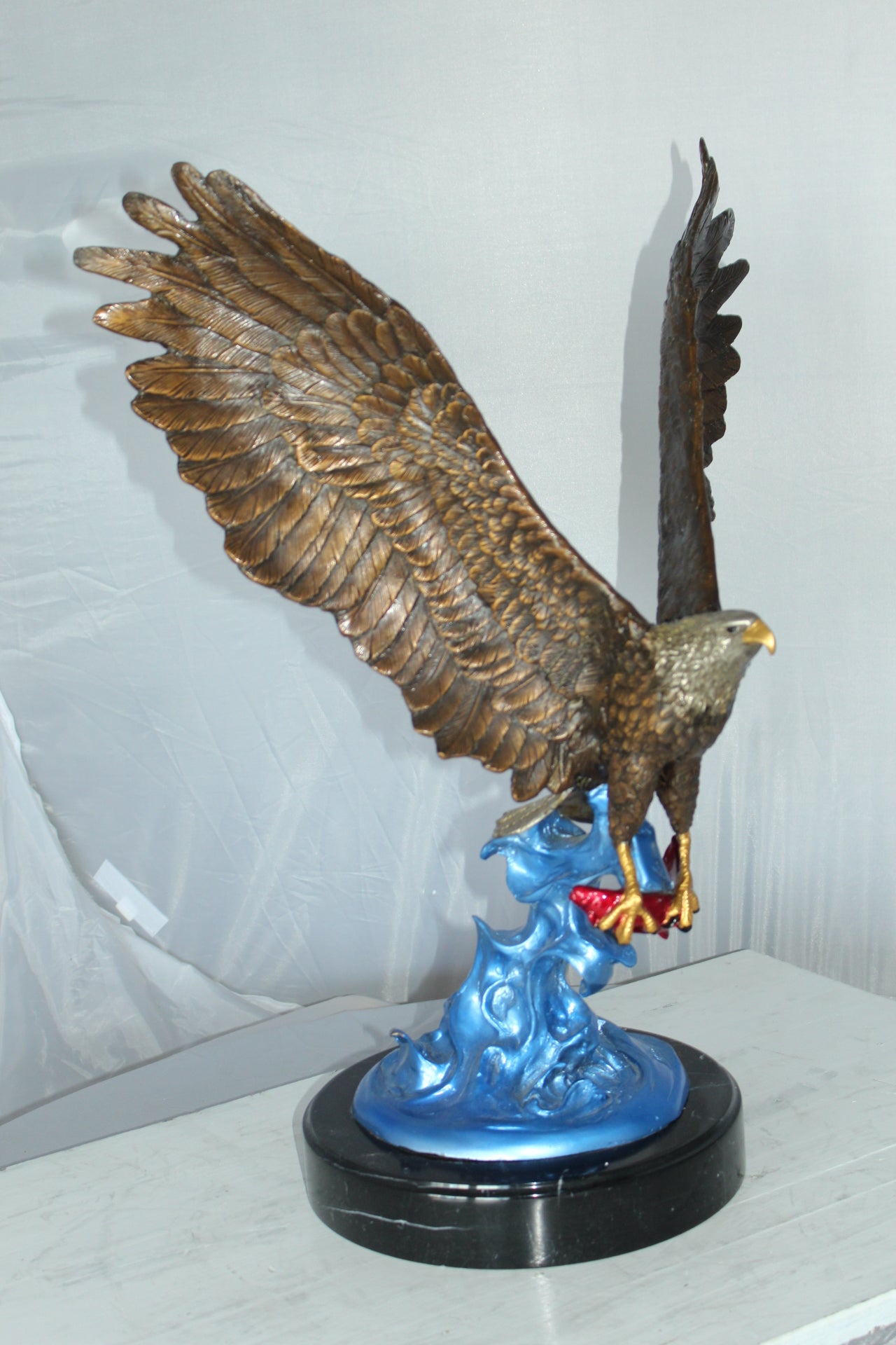 Eagle Catching his Prey Bronze Statue - Size: 17"L x 20"W x 25"H.