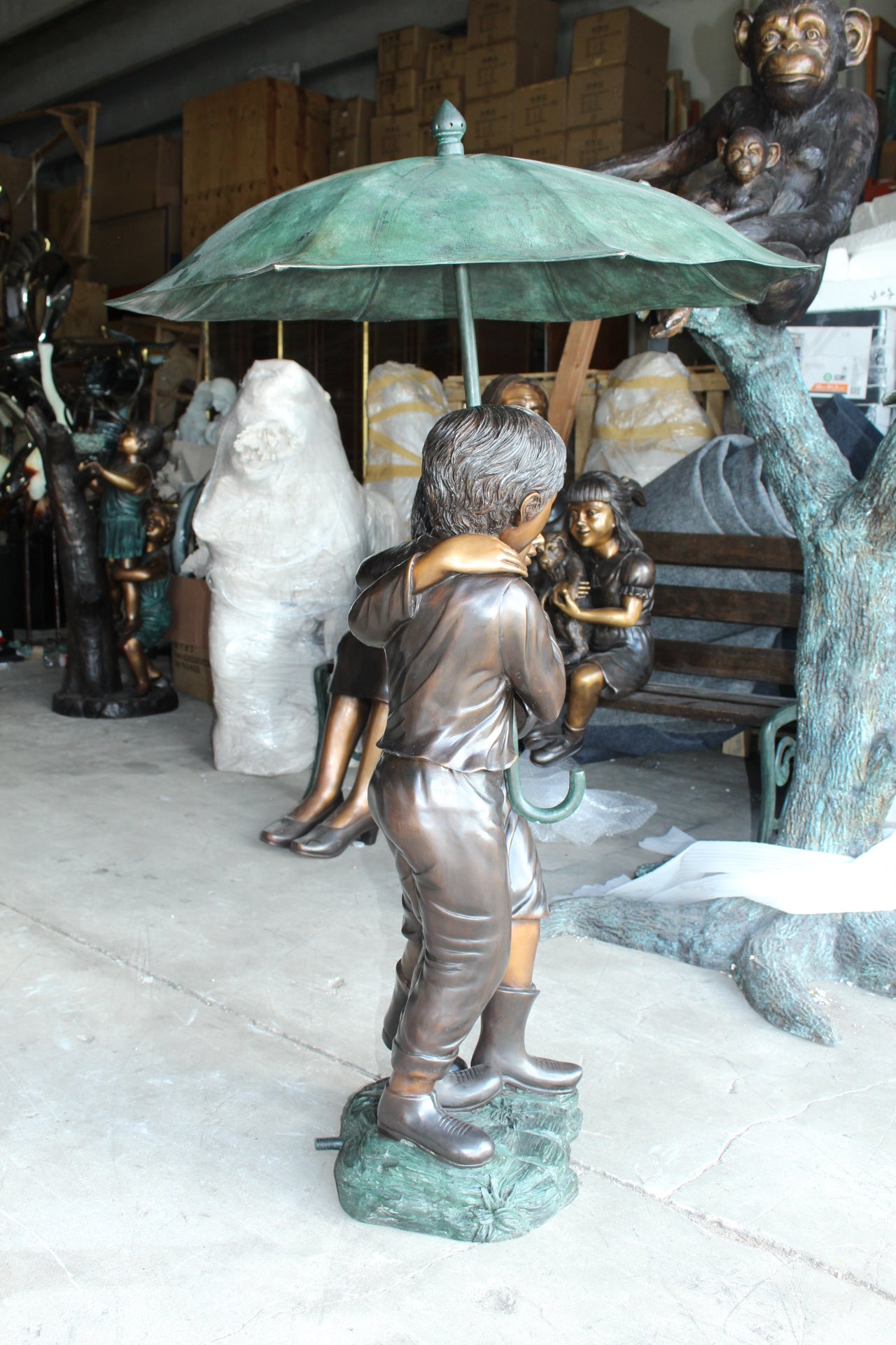 Two Kids Holding an Umbrella - Bronze Statue - Fountain - 90"L x 34"W x 90"H.
