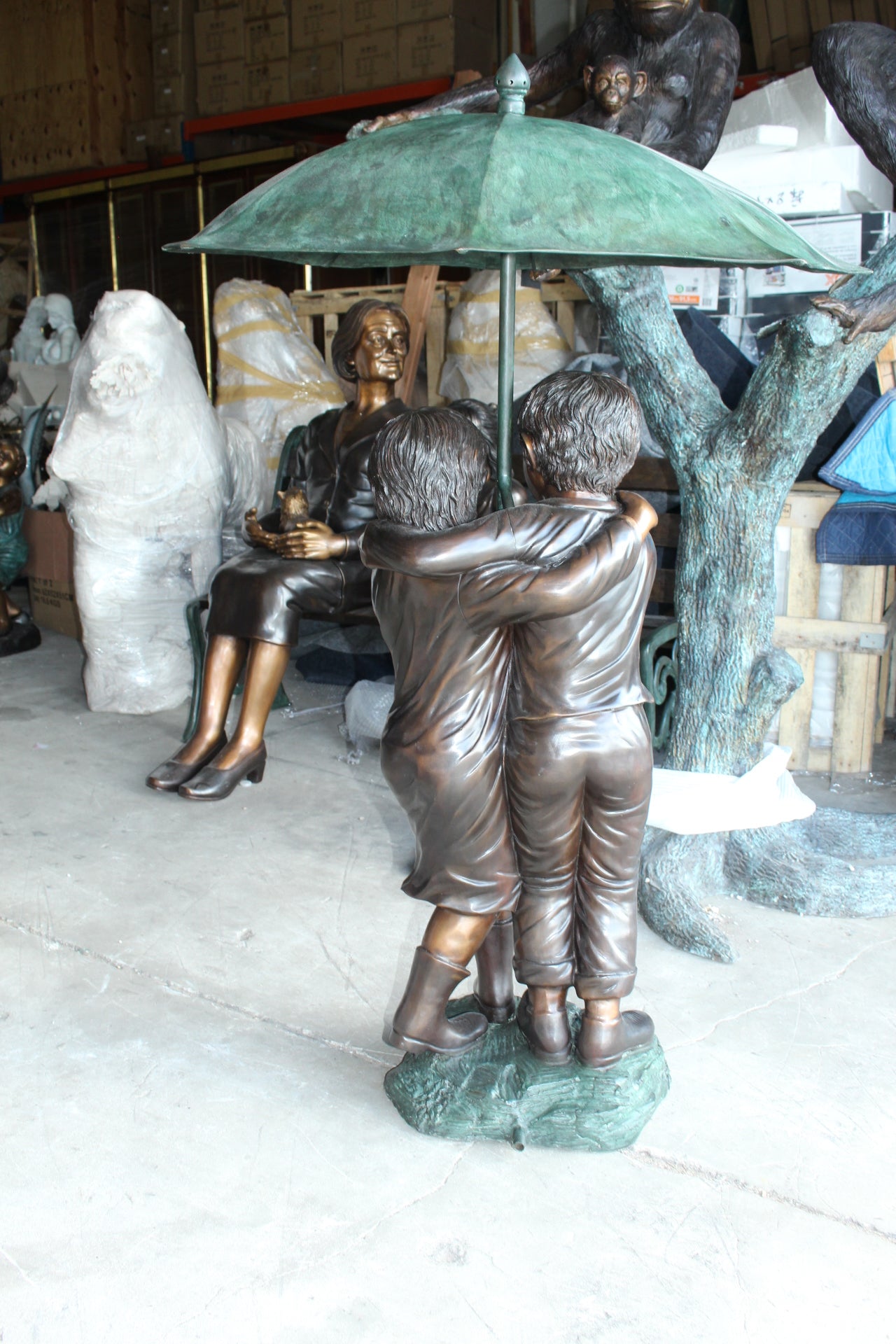 Two Kids Holding an Umbrella - Bronze Statue - Fountain - 90"L x 34"W x 90"H.