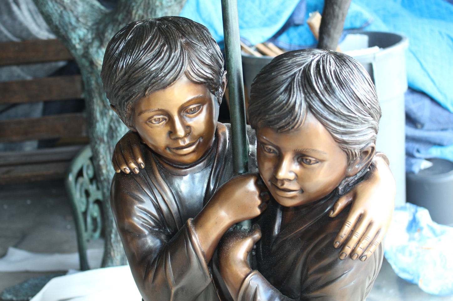 Two Kids Holding an Umbrella - Bronze Statue - Fountain - 90"L x 34"W x 90"H.