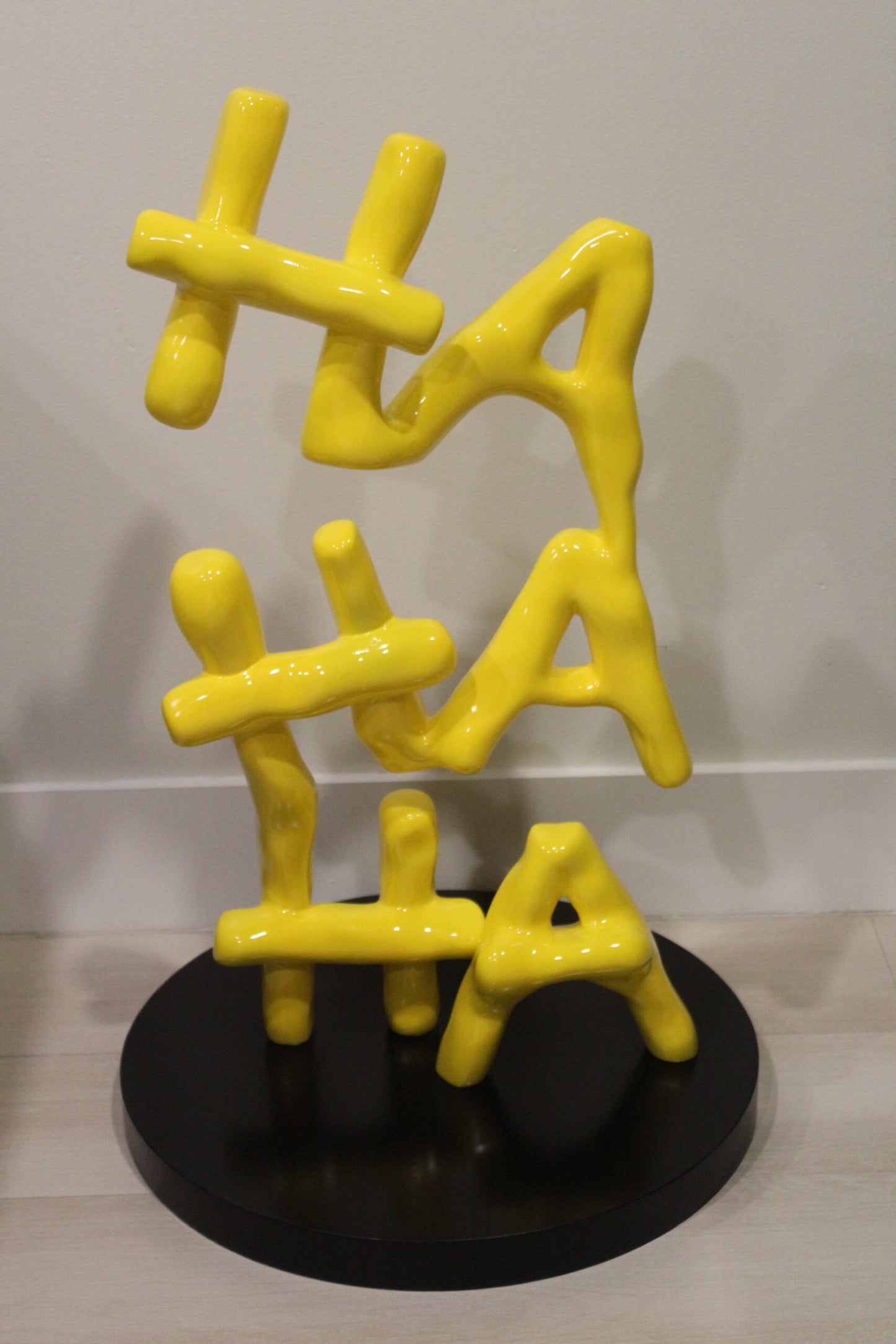 Yellow Pastel HA HA HA Resin Statue on Black Metal Base 20" x 20" x 31"H