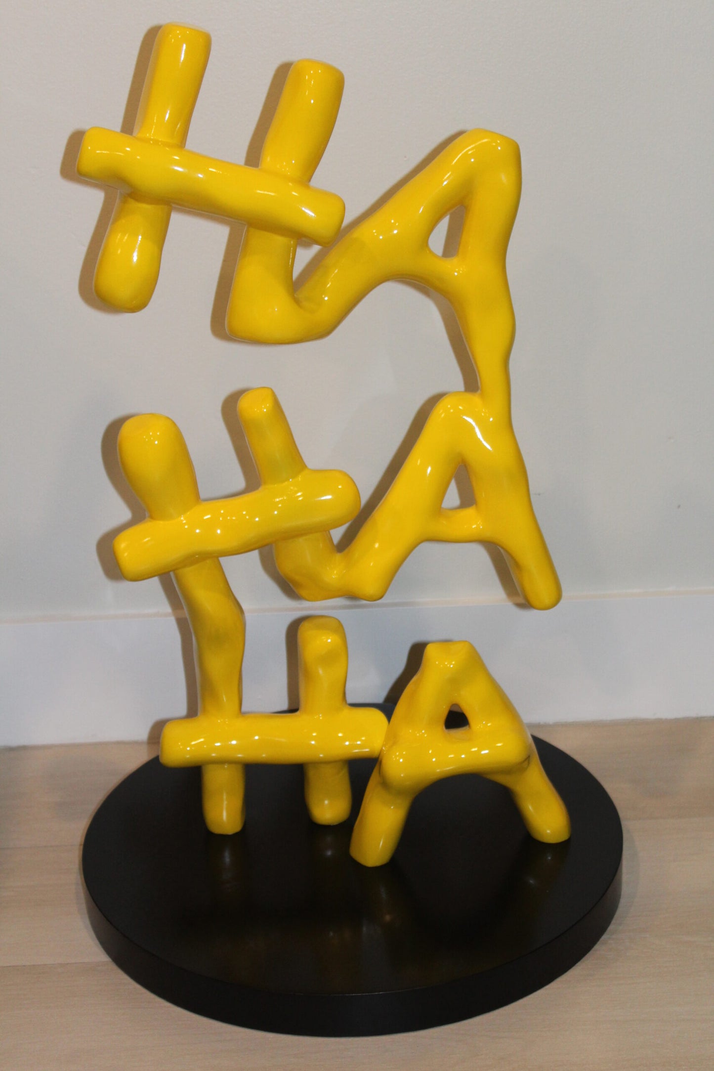 Yellow Pastel HA HA HA Resin Statue on Black Metal Base 20" x 20" x 31"H