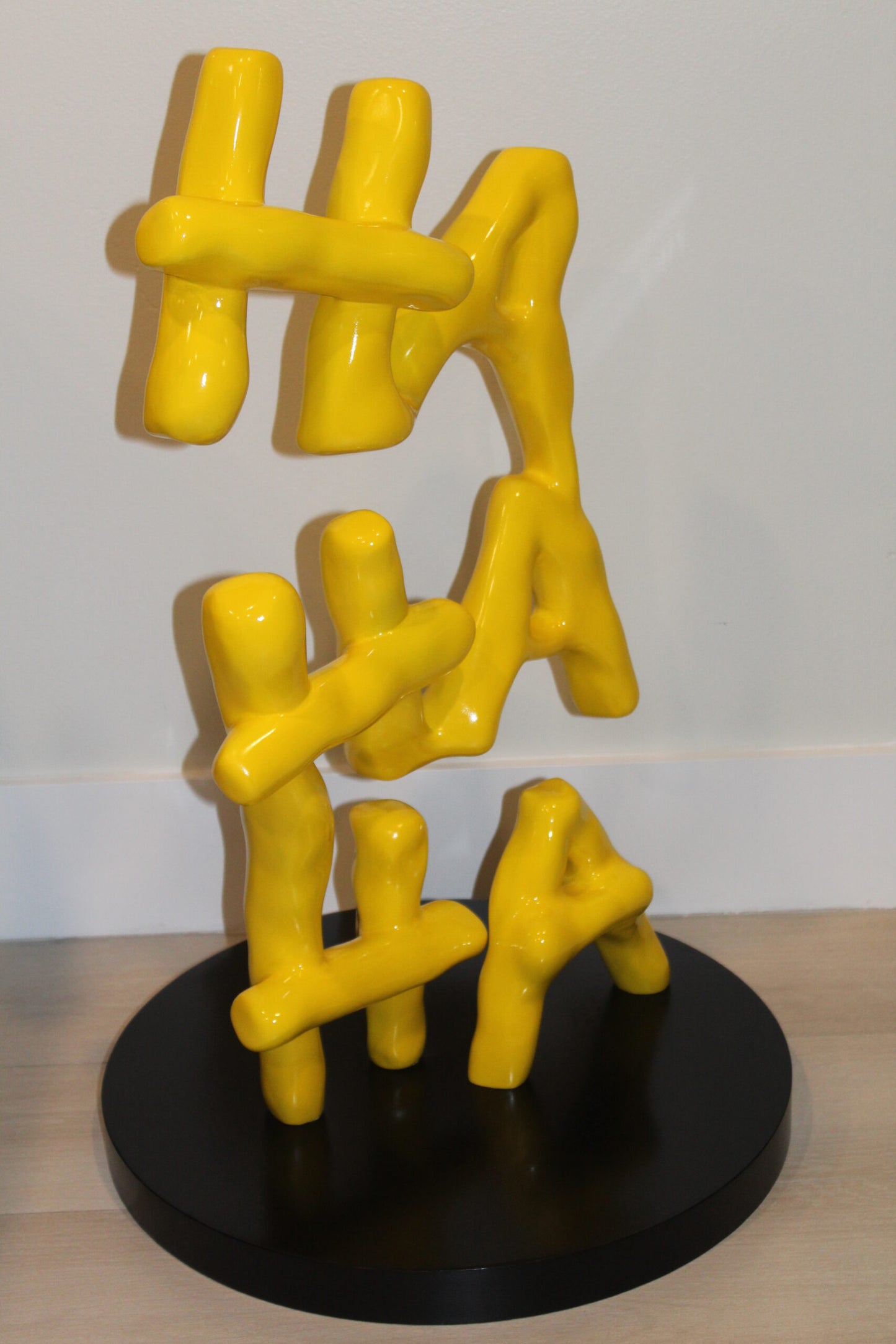 Yellow Pastel HA HA HA Resin Statue on Black Metal Base 20" x 20" x 31"H