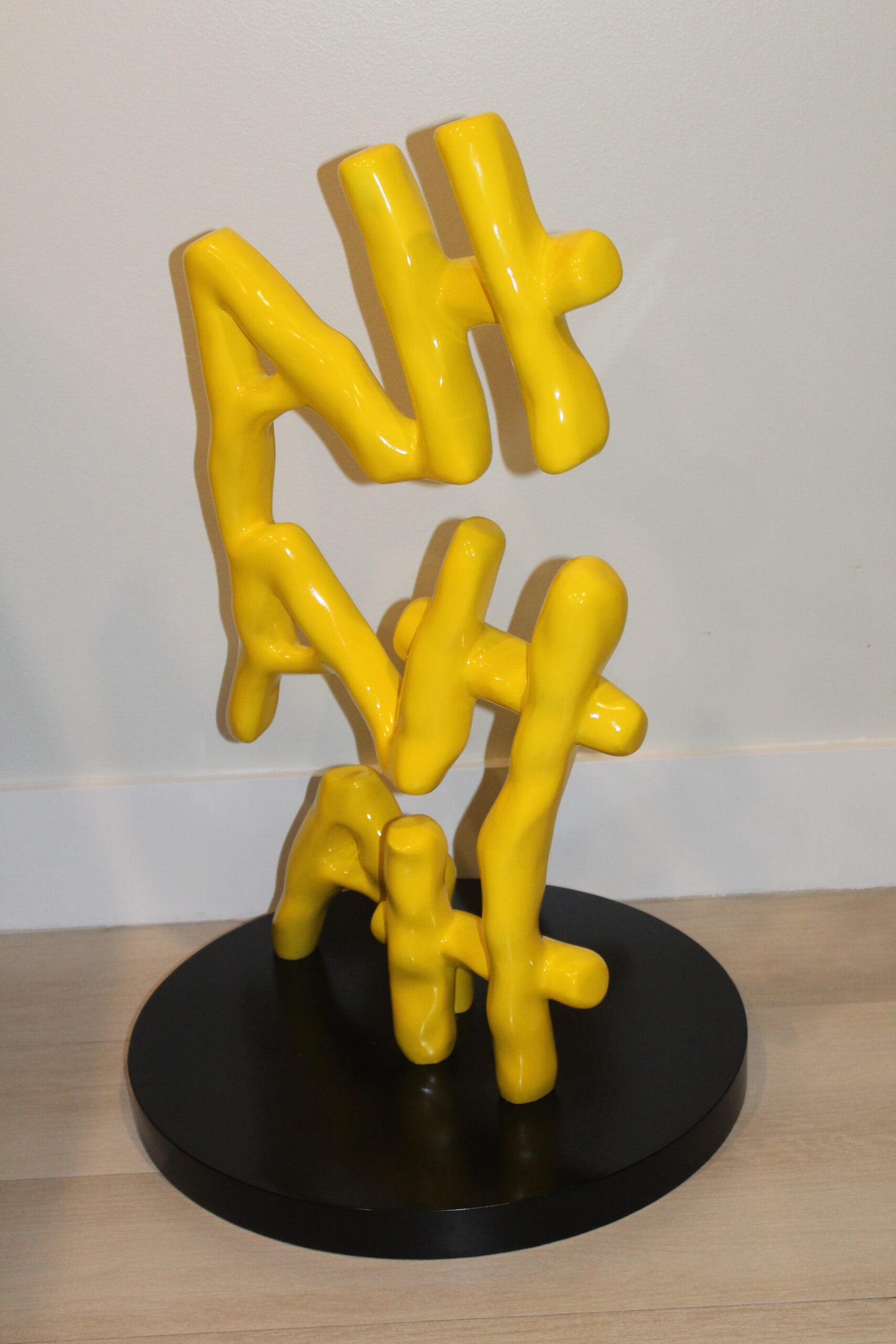 Yellow Pastel HA HA HA Resin Statue on Black Metal Base 20" x 20" x 31"H