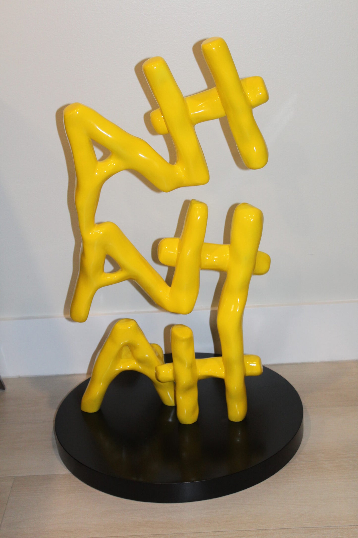 Yellow Pastel HA HA HA Resin Statue on Black Metal Base 20" x 20" x 31"H
