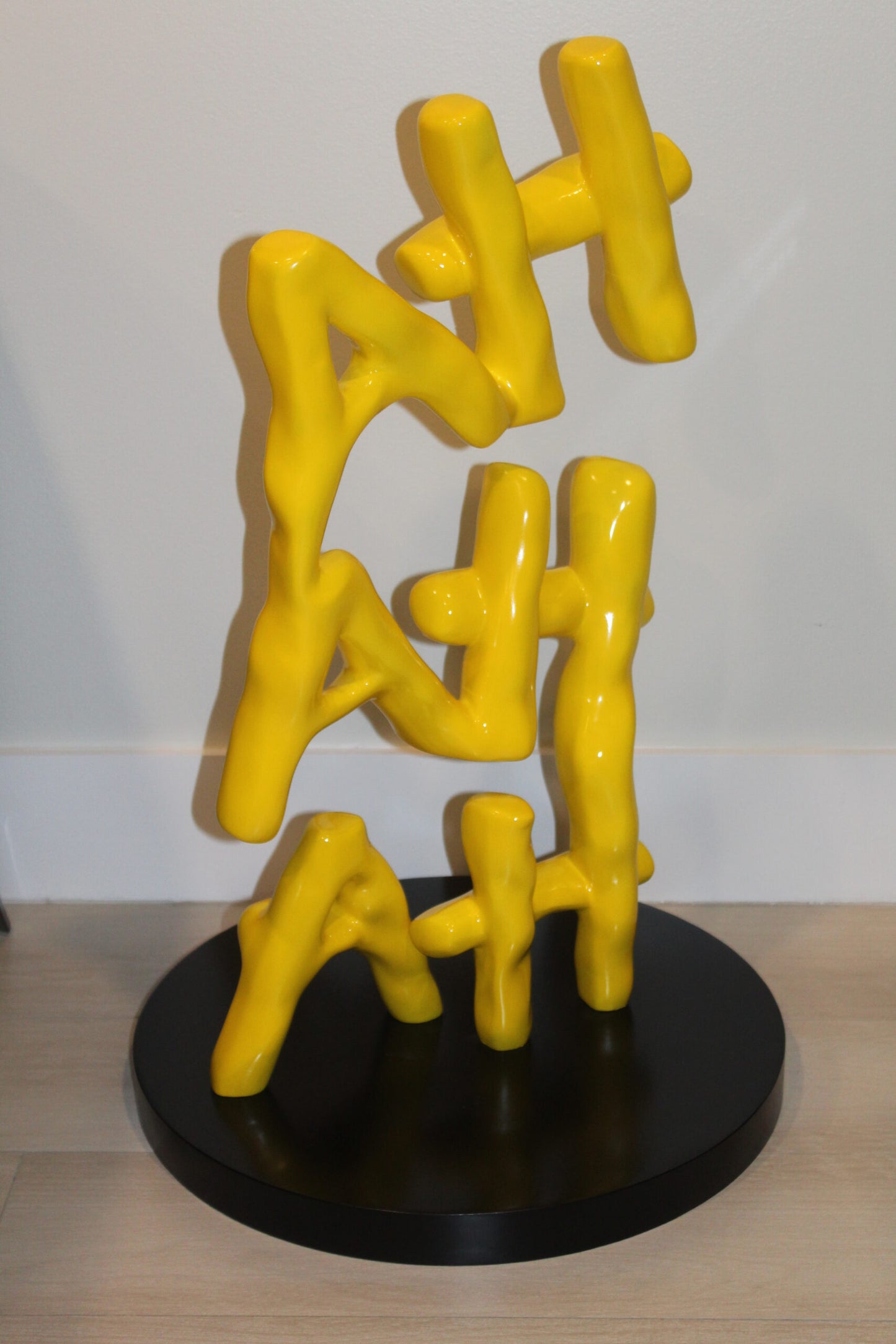Yellow Pastel HA HA HA Resin Statue on Black Metal Base 20" x 20" x 31"H