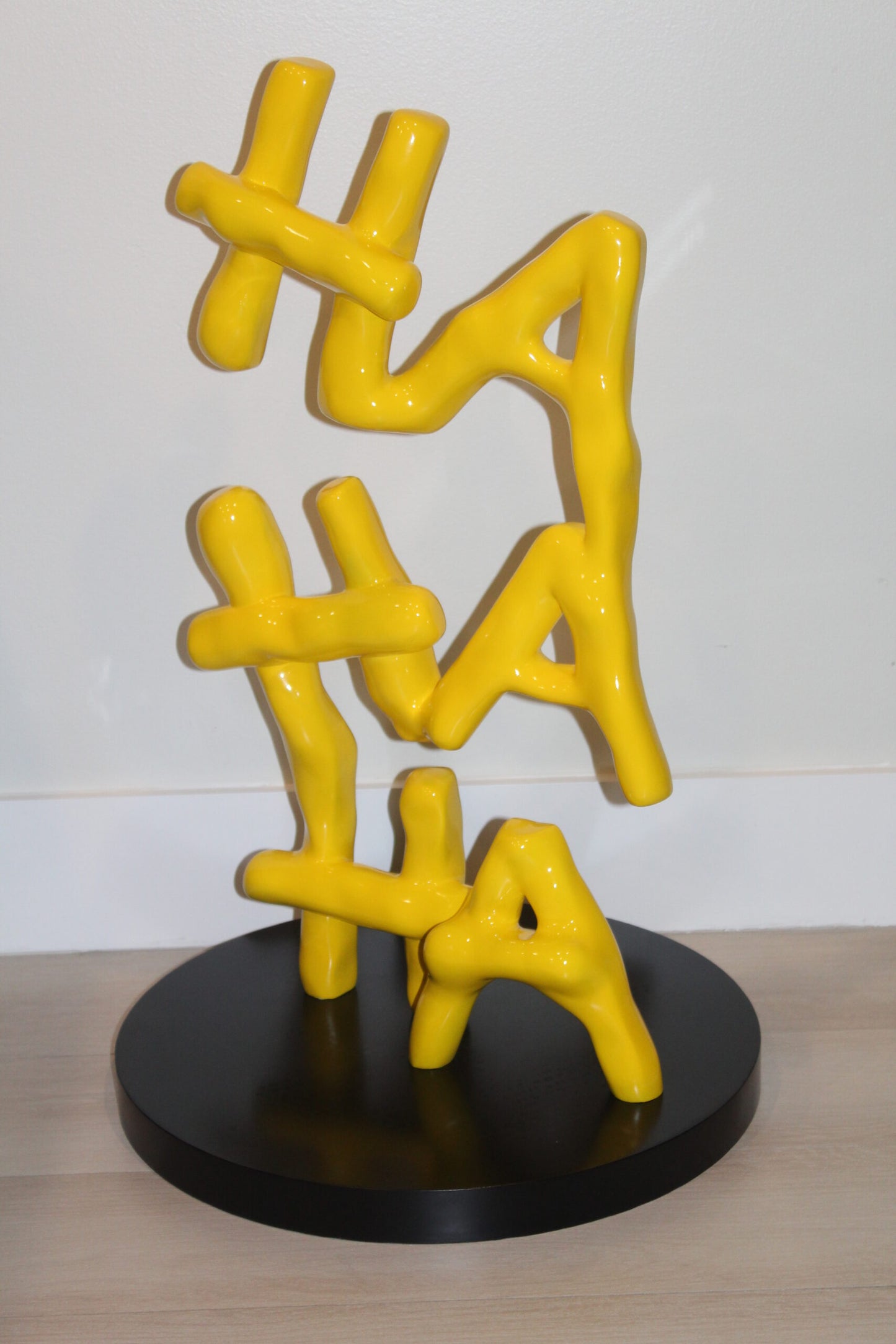Yellow Pastel HA HA HA Resin Statue on Black Metal Base 20" x 20" x 31"H