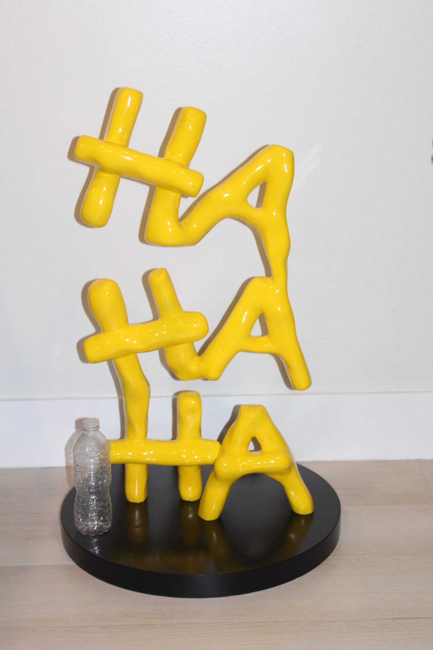 Yellow Pastel HA HA HA Resin Statue on Black Metal Base 20" x 20" x 31"H