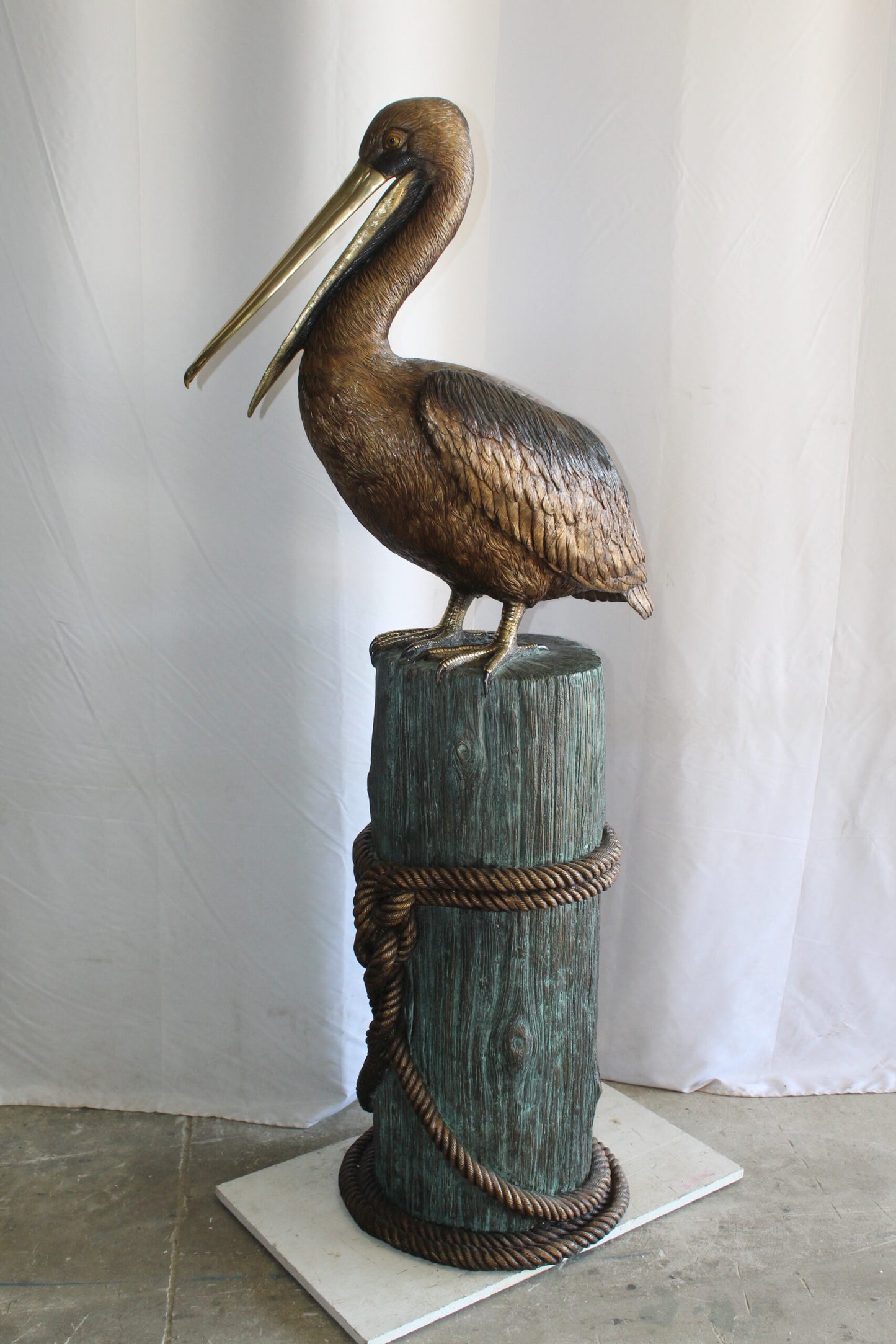 Lifesize Bronze Pelican Fountain Mounted on a Tree Stamp 33" x 23" x 73"H