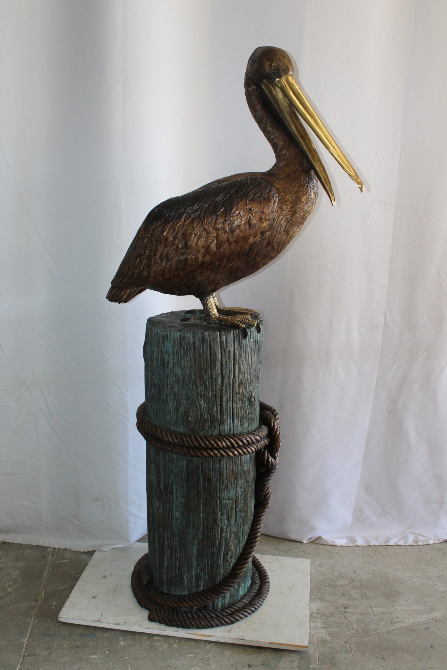 Lifesize Bronze Pelican Fountain Mounted on a Tree Stamp 33" x 23" x 73"H