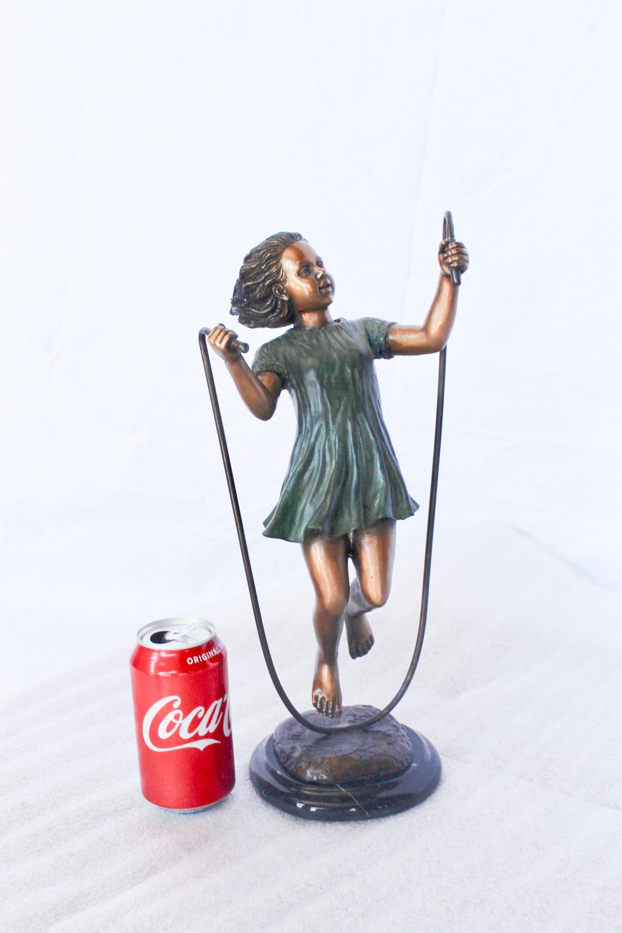 Young girl jump roping bronze statue -  Size: 5"L x 7"W x 15"H.