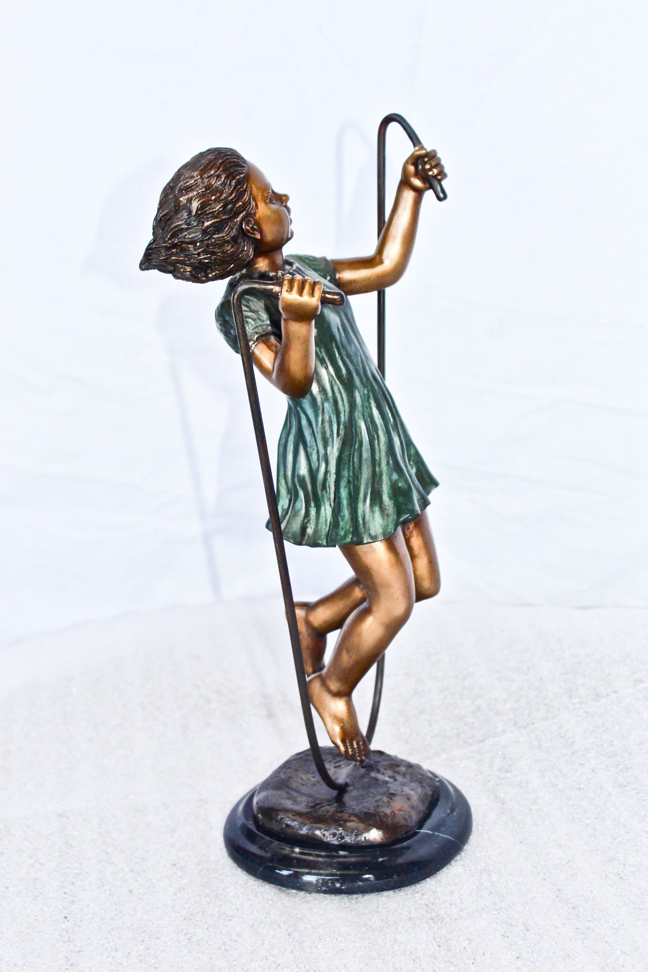 Young girl jump roping bronze statue -  Size: 5"L x 7"W x 15"H.
