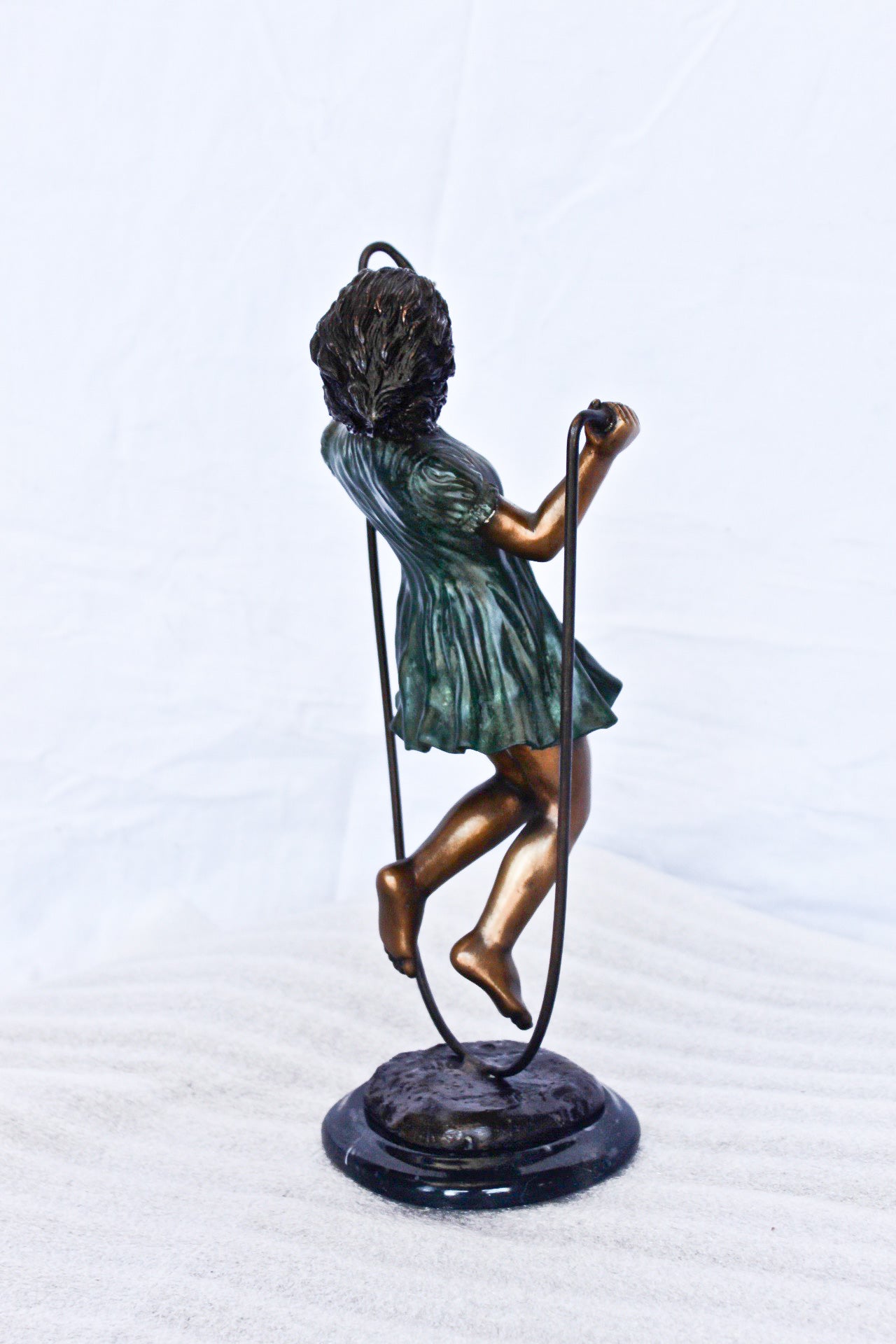 Young girl jump roping bronze statue -  Size: 5"L x 7"W x 15"H.