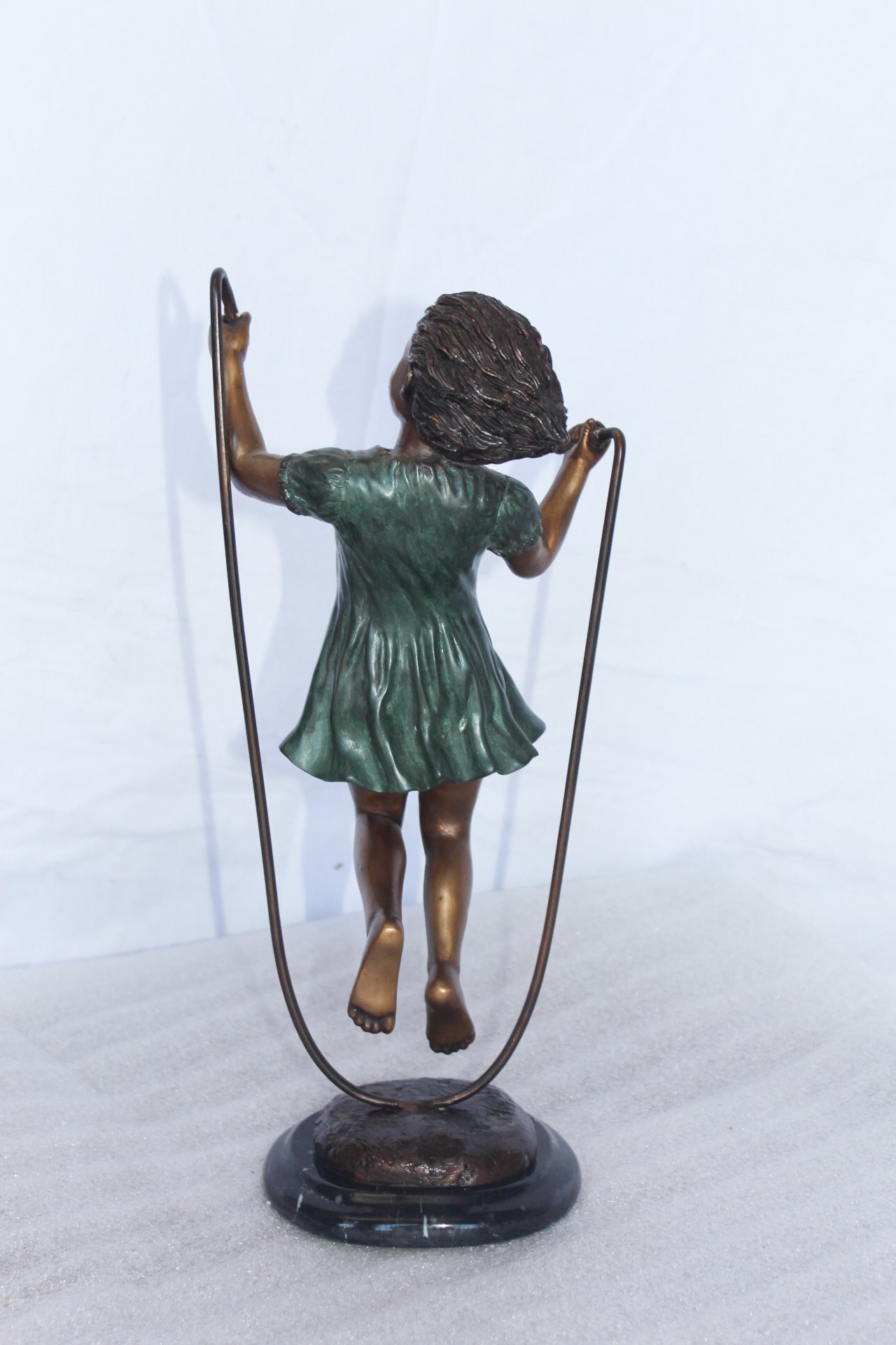 Young girl jump roping bronze statue -  Size: 5"L x 7"W x 15"H.