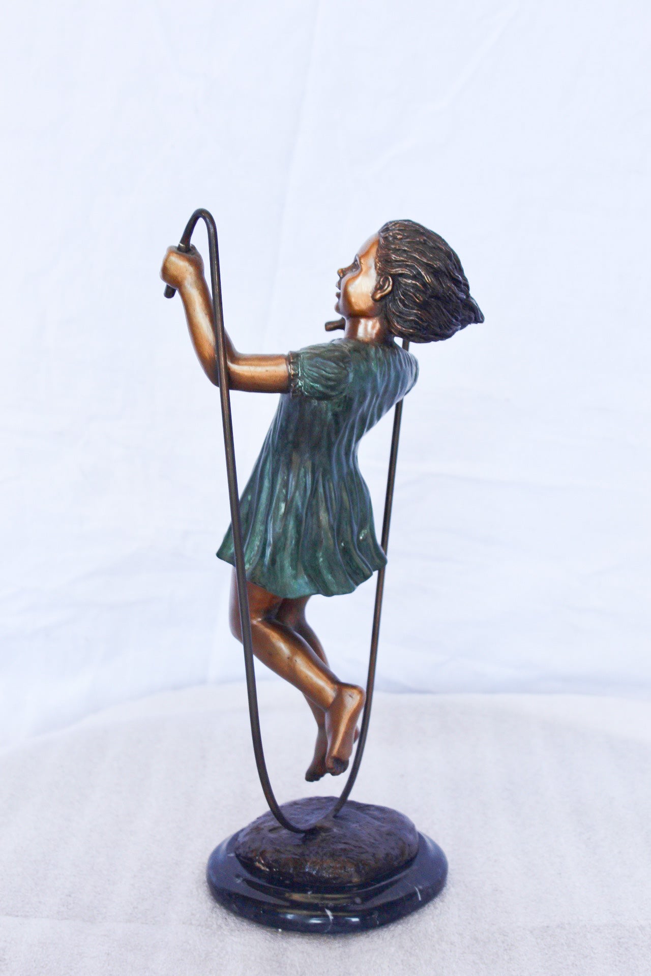 Young girl jump roping bronze statue -  Size: 5"L x 7"W x 15"H.