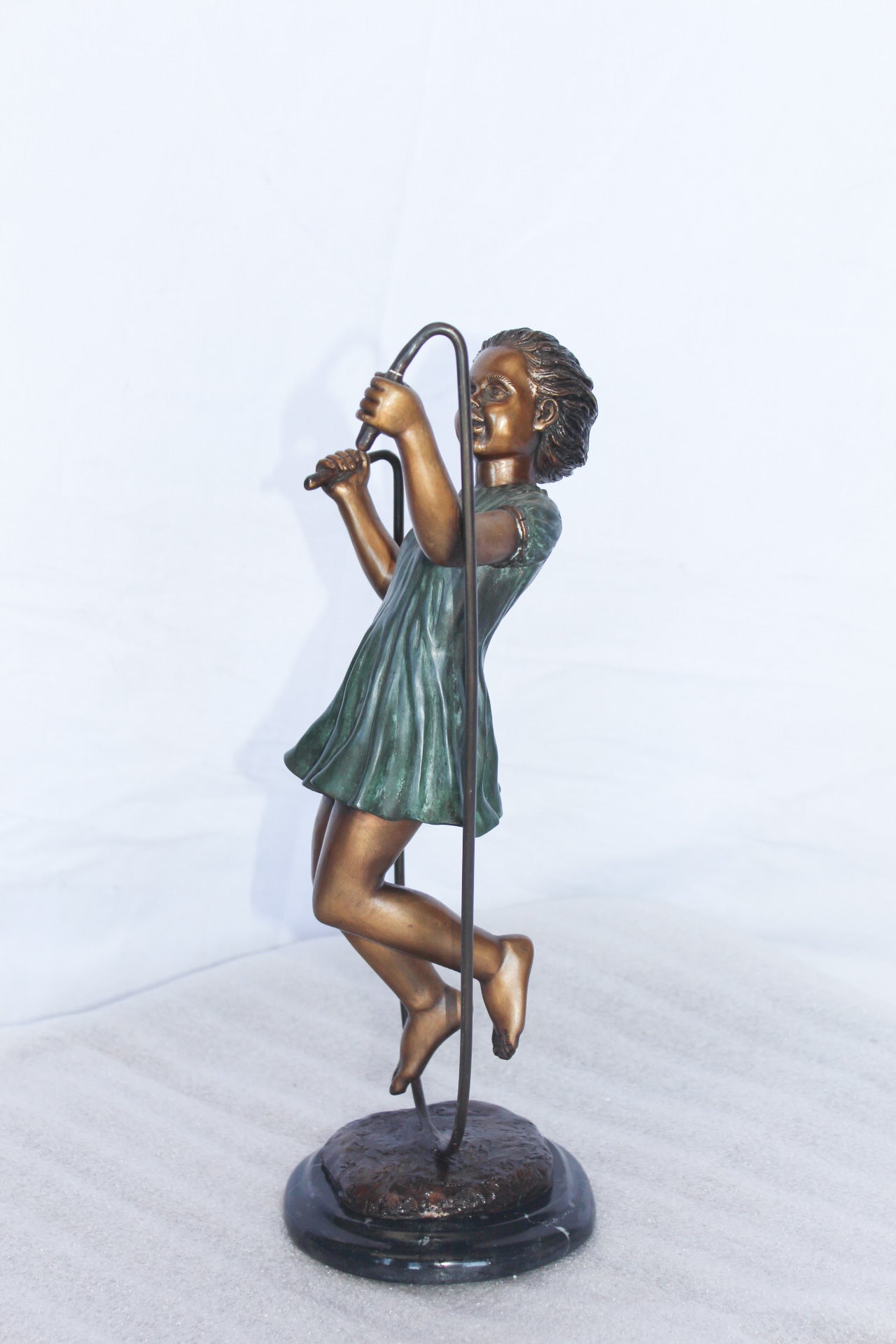 Young girl jump roping bronze statue -  Size: 5"L x 7"W x 15"H.