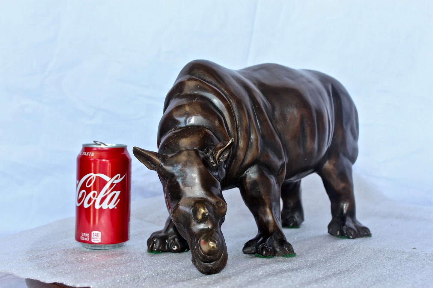 Relaxed Rhino bronze statue - Size: 16"L x 9"W x 8"H.