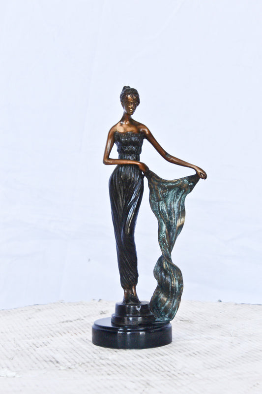 Young girl holding a sheer sheet in the wind - Size: 6"L x 4"W x 13"H.