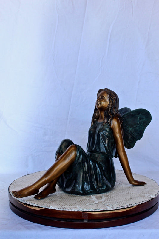 Fairy angel sitting peacefully bronze statue - Size: 27"L x 12"W x 16"H.