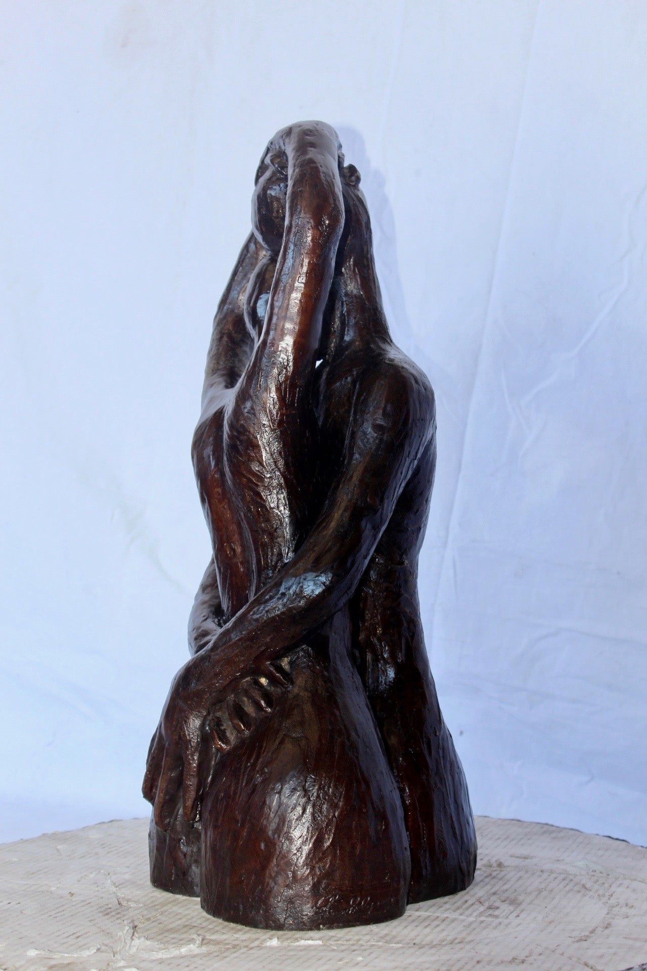 Lovers embracing one another bronze statue - Size: 13"L x 10"W x 24"H.