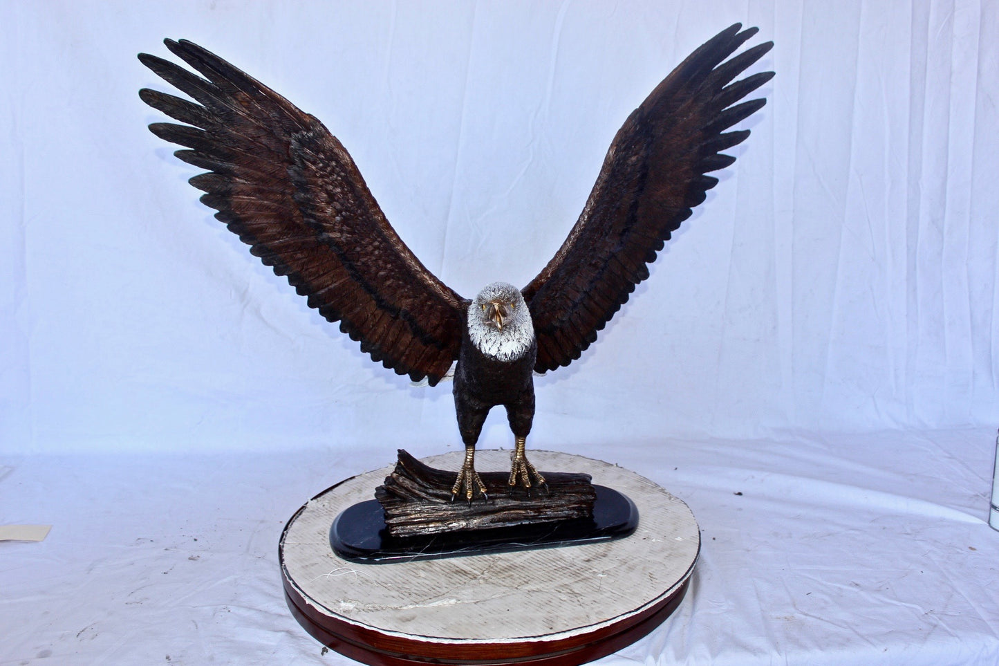 Perched eagle bronze statue - Size: 35"L x 21"W x 29"H.